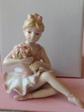 Porcelain Ballerina in Pink Dress Sitting Figurine